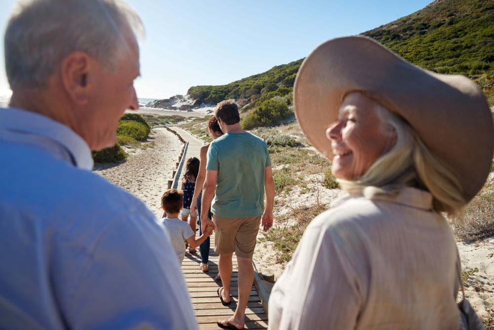 Senior couple on a walk with their family